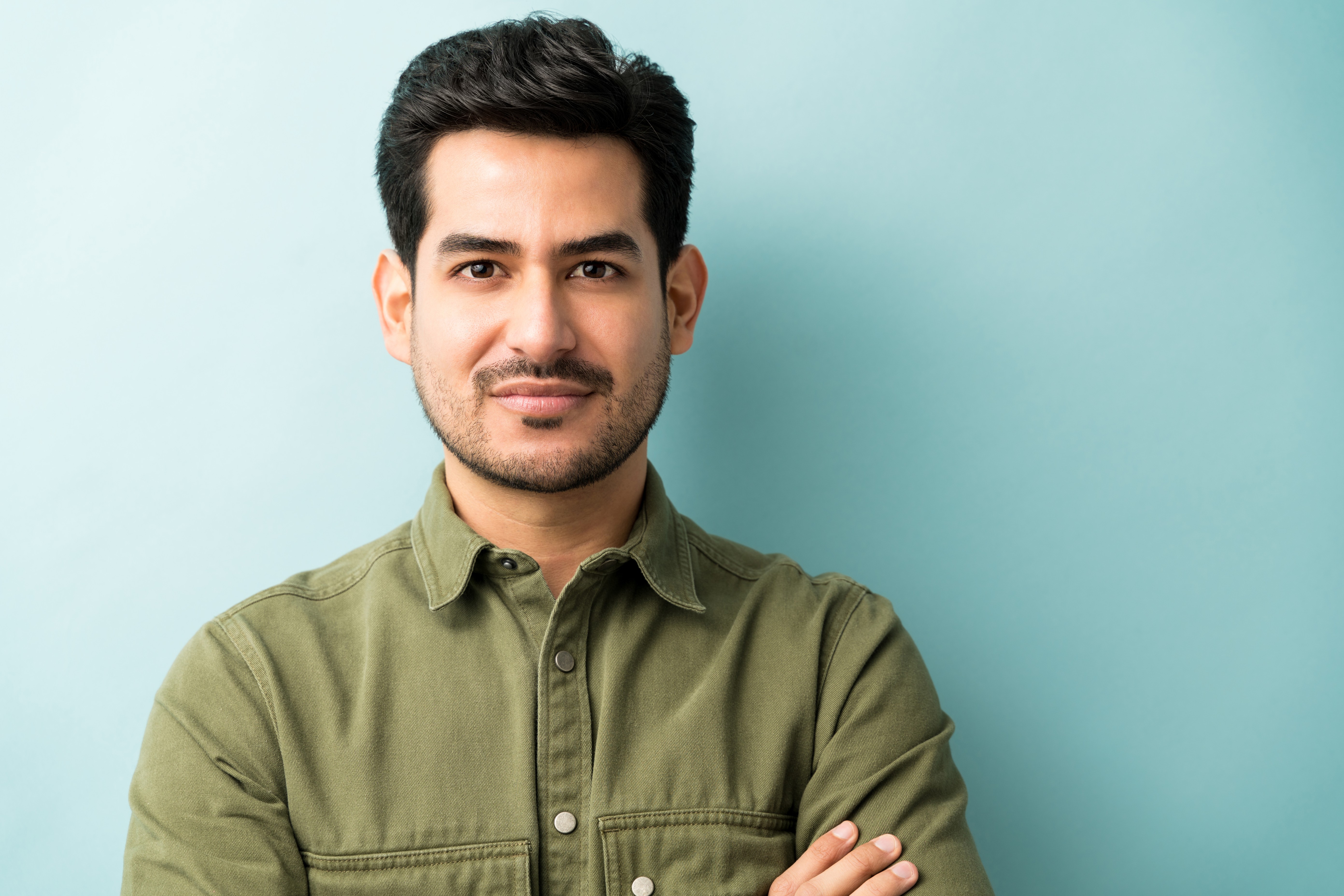 closeup young hispanic man casuals studio 1